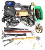 A collection of gun and shooting accessories including Parker-Hale cleaning kits, Hawke Vantage 4x32