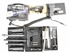 A collection of guns and gun accessories including Concorde Defender paintball pistol serial