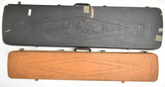 Two shotgun or rifle hard carry cases with padded interiors, one with decoration of rams, largest