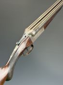 Thomas Wild 12 bore side by side shotgun with named and engraved locks, engraved underside,