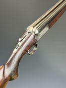 SKB 12 bore side by side shotgun with named locks, chequered semi-pistol grip and forend, single