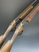 A pair of William Powell 20 bore over under ejector shotguns each with rose and scroll engraving