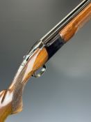 Browning Citori 12 bore over and under ejector shotgun with named underside, chequered semi-pistol