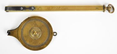 Two brass percussion cap dispensers, one an indistinctly named rotary example the other stamped 'KS'