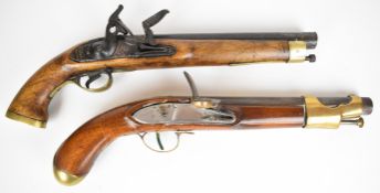Two flintlock pistols both with brass trigger guard, butt plate and mounts, one with steel ram-rod