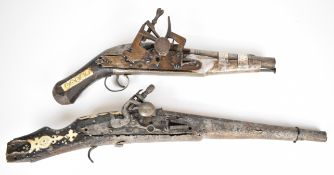 Two Eastern flintlock pistols, both with Roman style lock and bone inlaid decoration to the stock,