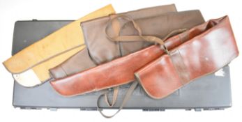 Two shotgun or rifle padded hard carry cases, one with decoration of stags and ducks and the other