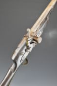 Eastern flintlock gun with mother of pearl inlaid decoration to the stock, brass trigger guard, butt