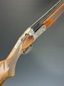 Winchester Supreme 12 bore over and under ejector shotgun with engraved scenes of birds to the