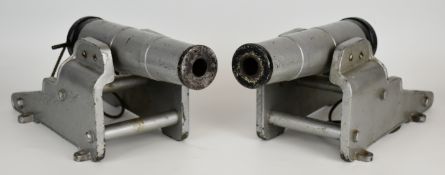 A pair of 12 bore breech loading blank firing signalling cannon, each with 11 inch graduated
