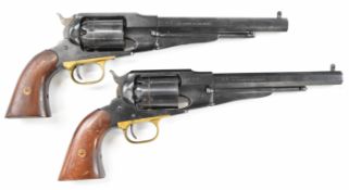 A pair of Pietta .44 six-shot single-action revolvers, each with brass trigger guard, wooden grips