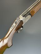 Lanber 12 bore over and under ejector shotgun with engraved scenes of birds to the action and