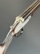 Beretta 12 bore side by side ejector shotgun with rose and scroll engraved sidelock plates,