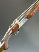 Perazzi SC3 12 bore over under ejector shotgun with rose and scroll engraved action, underside and