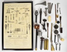 A collection of gun tools and accessories including wad punches, oil bottle, Eley percussion cap