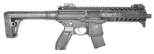 Sig Sauer MP .177 CO2 assault style air rifle with textured pistol grip, multi-shot magazine and