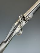 Flintlock sporting gun with lock stamped 'Warranted' and engraved with an elephant, carved