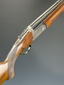 Lincoln 12 bore over and under ejector shotgun with engraved action, underside, trigger guard, top