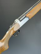 Marocchi 12 bore over and under shotgun with engraved scenes of dogs and birds to the locks and