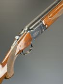 Winchester Model 400 12 bore over and under ejector shotgun with engraved action and underside,