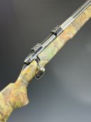 Weatherby Mark V .243 Winchester bolt-action rifle with Bill Jordan's Advantage Timber camouflage
