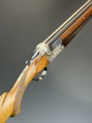 AYA Coral 12 bore over and under ejector shotgun with heavily carved action featuring scenes of dogs