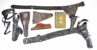 Six revolver or pistol holsters including a brown leather cavalry bucket holster and Luger P08 or