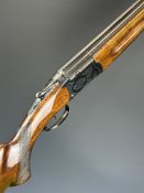 Zabala 12 bore over and under shotgun with engraved locks, underside and thumb lever, chequered