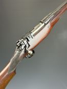 Cogswell & Harrison .410 bolt-action shotgun converted from a rifle, with chequered grip and forend,