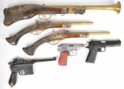 Six replica guns and pistols comprising a blunderbuss and pair of brass barrelled pistols all with