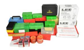 A collection of shotgun and rifle cartridge re-loading equipment including auto drum powder measure,