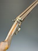 Husqvarna 12 bore side by side hammer action shotgun with engraved scenes of dogs to the locks,