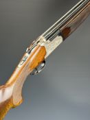 Lanber 12 bore over and under ejector shotgun with engraved scenes of birds to the action and