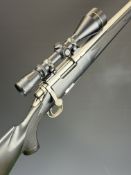 Remington 700 .243 Winchester bolt-action rifle with composite stock, chequered semi-pistol grip and