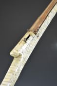 Indian matchlock gun decorated with mother of pearl panels and with brass wire barrel bands and 44.5