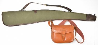 Brown leather shotgun cartridge bag with canvas sling, together with a leather trimmed canvas