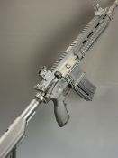 Heckler & Koch HK 416 D .22 semi-automatic assault style rifle with textured pistol grip, tactical