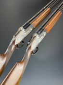 A pair of AYA 12 bore over and under sidelock ejector shotguns each with engraved scenes of dogs and