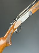 Valmet 12 bore over and under ejector shotgun with engraved locks and underside, ornate chequered