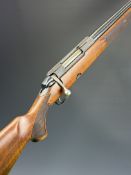 Tikka M595 .22-250 bolt-action rifle with chequered semi-pistol grip and forend, sling mounts and 23