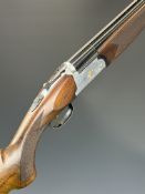 Lincoln Premier 12 bore over and under ejector shotgun with engraved scenes of gold birds to the