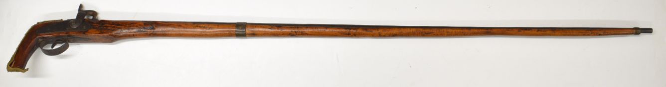 Eastern percussion hammer action gun with Chinese coin mount, pistol grip and 52 inch barrel,