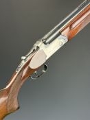 AYA Yeoman 12 bore over and under ejector shotgun with named action and underside, chequered semi-