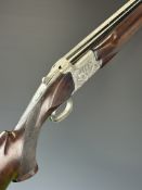 Browning GTI 12 bore over and under ejector shotgun with engraved scenes of birds and dogs to the