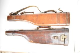 Two brown leather leg of mutton shotgun carry cases, both with fitted interior and approximately
