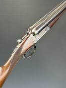 BSA 12 bore side by side ejector shotgun with named locks, chequered grip and forend, vacant