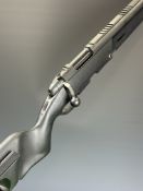 Steyr Scout .243 bolt-action rifle with composite stock, semi-pistol grip, adjustable trigger, scope