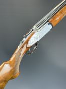 Rizzini 12 bore over and under ejector shotgun with engraved scenes of birds to the sidelock
