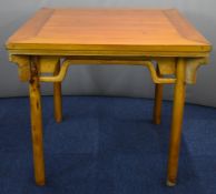 19thC Chinese jointed elm table with moulded supports, raised on four circular legs, W95 x D95 x