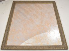 Large mirror with moulded frame and distressed glass, 137 x 158cm